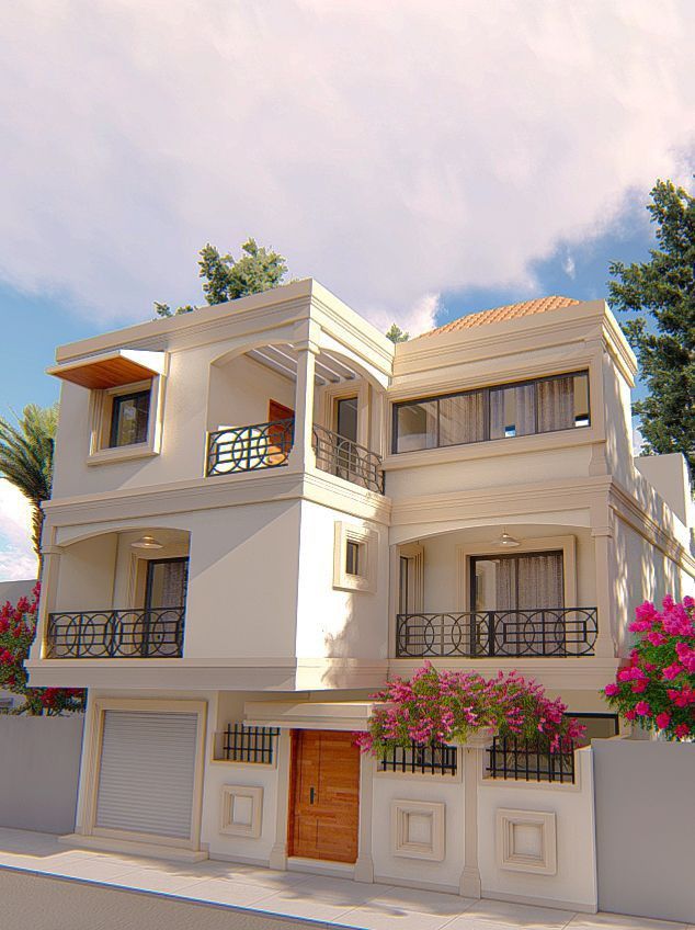 a three story white house with pink flowers on the balconies