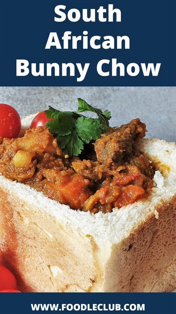 a close up of a sandwich with meat and tomatoes on it, text reads south african bunny chow