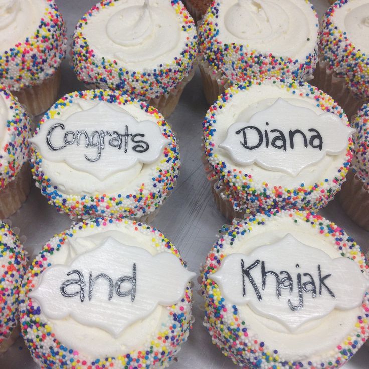 cupcakes with white frosting and colorful sprinkles that say congrats, diama, and khaki