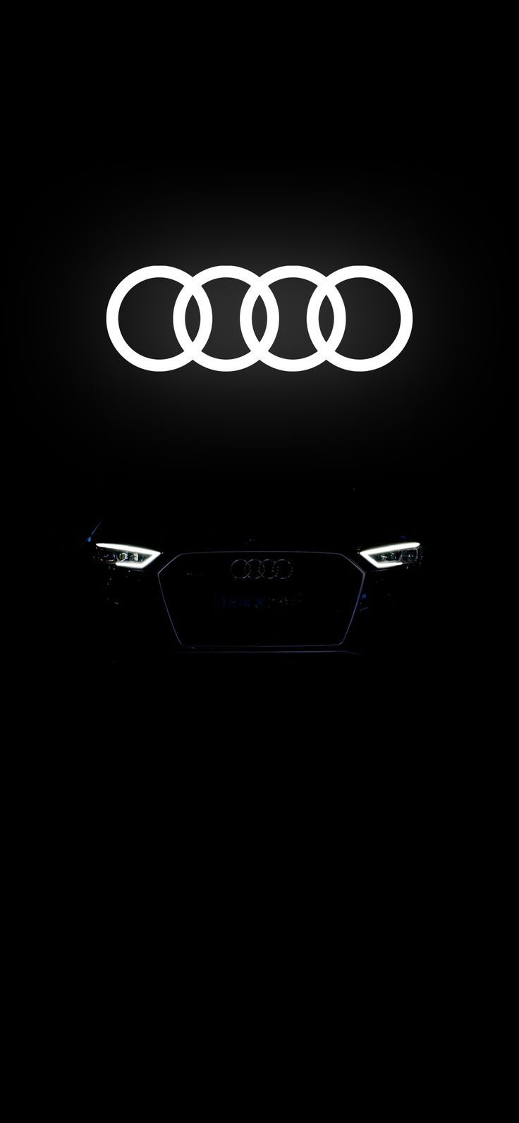 an audi logo is lit up in the dark