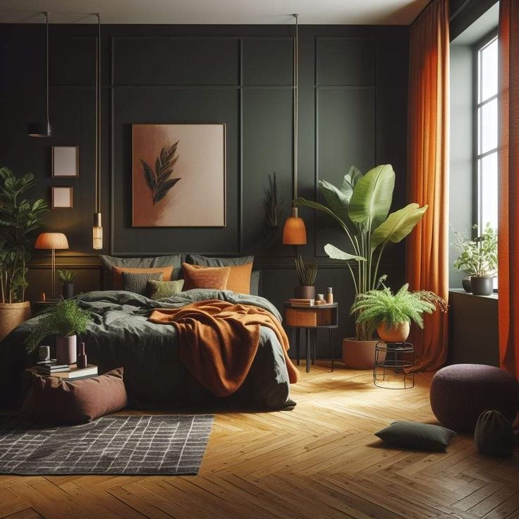 a bedroom with black walls, wooden floors and lots of greenery in the corner