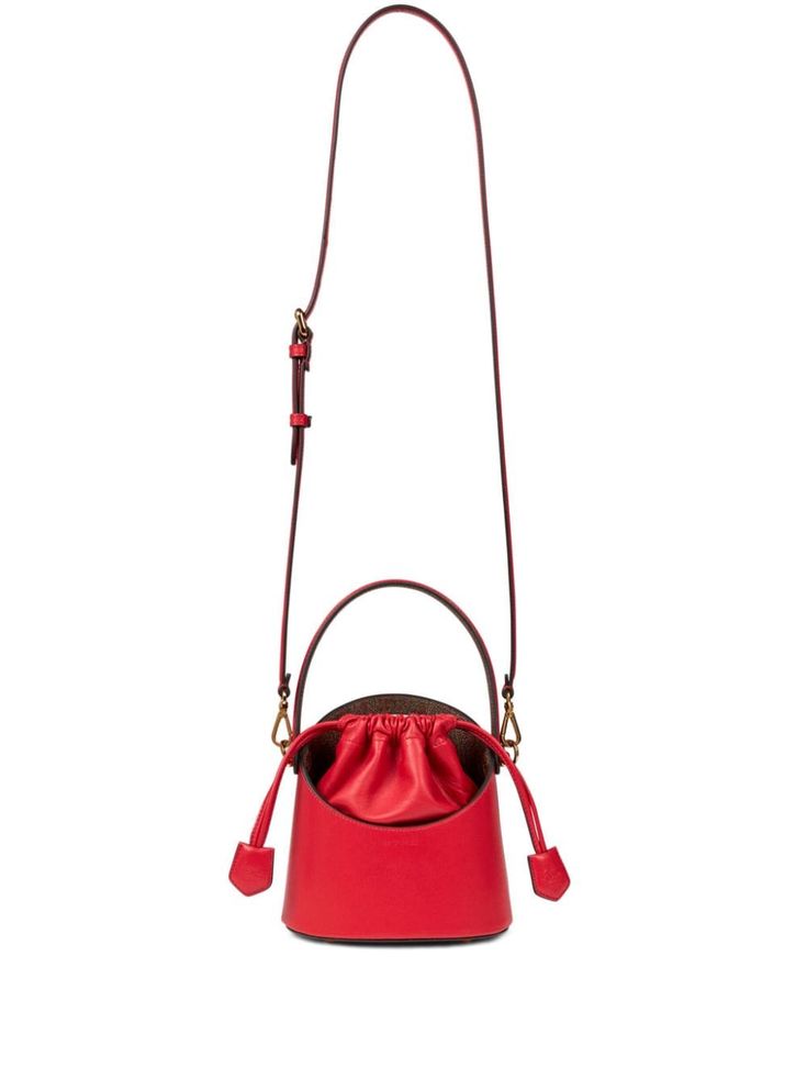 bright red calf leather bucket body double layer single flat top handle adjustable detachable shoulder strap cut-out top handle logo-engraved gold-tone hardware debossed logo to the front main compartment internal patch pocket paisley print full lining top drawstring fastening Debossed Logo, Chanel 2, Loafer Mules, Iconic Bags, Leather Bucket Bag, Leather Bucket, Summer Beach Wear, Pump Sandals, Ballet Flat Shoes