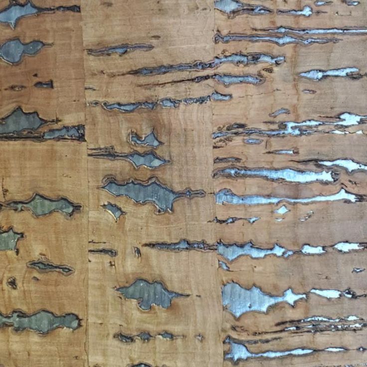 an image of wood that is peeling and chipped with some paint on the surface