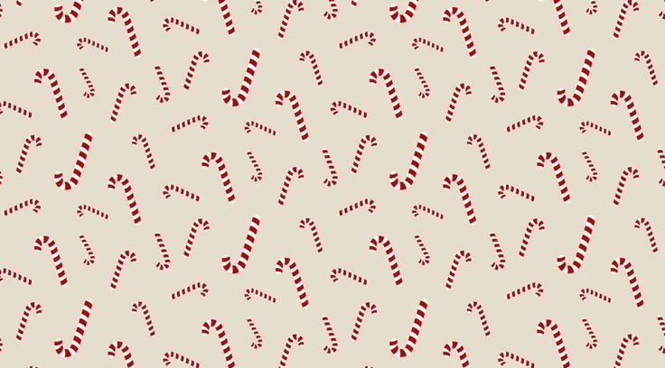 a pattern with candy canes on a beige background