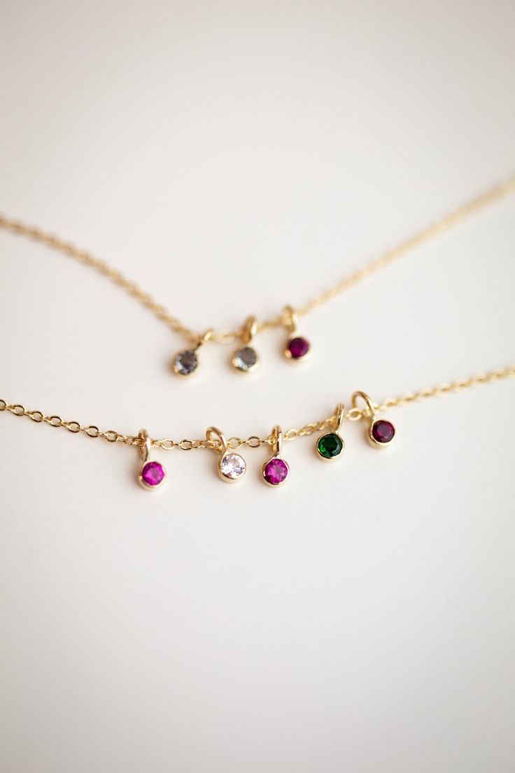 This exquisite necklace, crafted from 14k yellow or white gold, is the epitome of elegance and sophistication. A perfect keepsake to commemorate beloved family members and cherished loved ones. 14k solid gold 2mm small round bezel charm with lab created birthstone •• January—Garnet •• February—Amethyst •• March—Aquamarine •• April—White sapphire •• May—Emerald •• June—Alexandrite •• July—Ruby •• August—Peridot •• September—Sapphire •• October—Tourmaline •• November—Topaz •• December—Blue zircon May Emerald, September Sapphire, Meaningful Jewelry, Blue Zircon, Birthstone Charms, Birthstone Necklace, White Sapphire, Family Members, Tourmaline