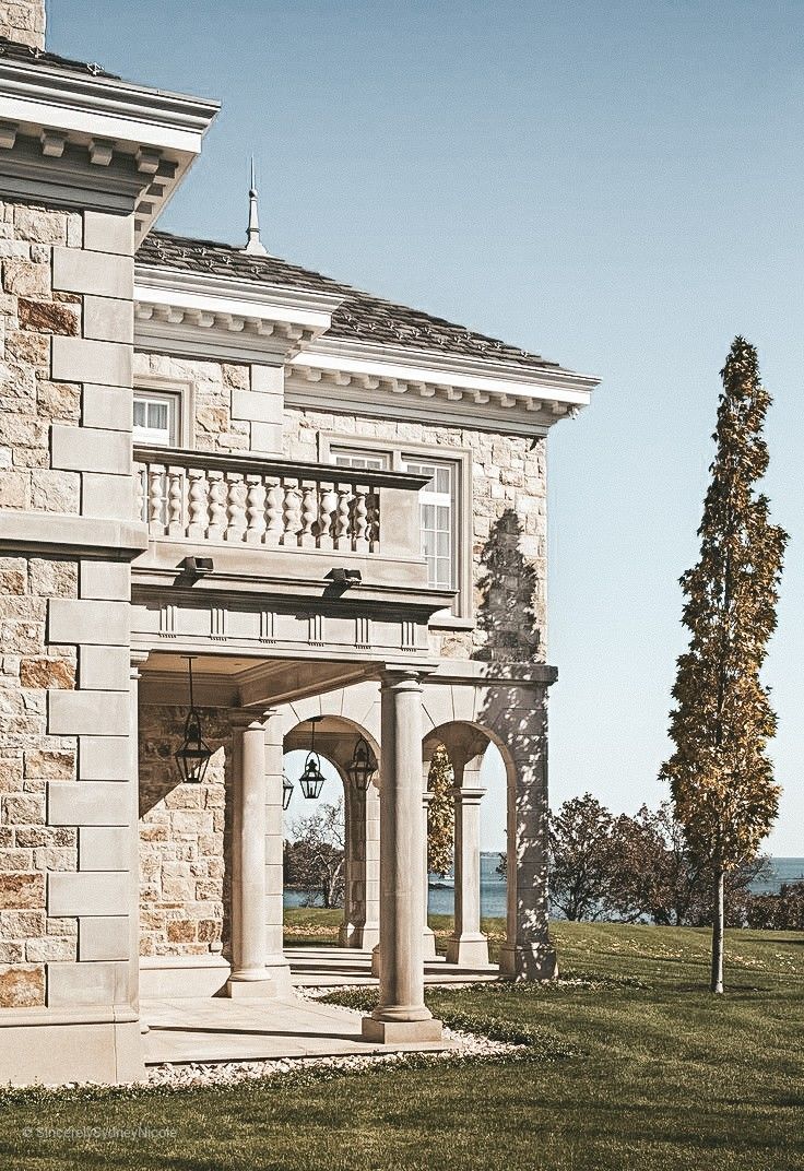 a large stone building with pillars and arches