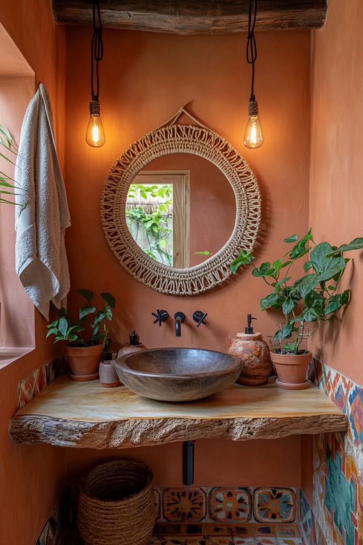 a bathroom with a sink, mirror and potted plants