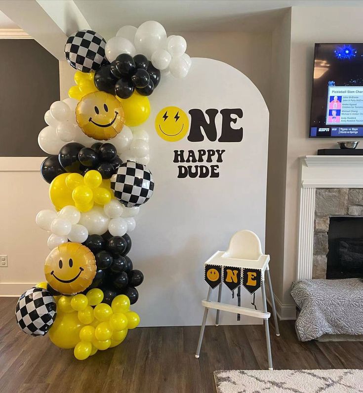 balloons are arranged in the shape of smiley faces and checkered black and white squares