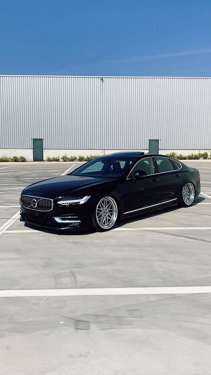 a black car parked in a parking lot