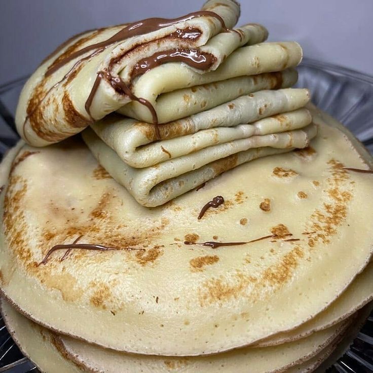 stack of pancakes with chocolate sauce on top