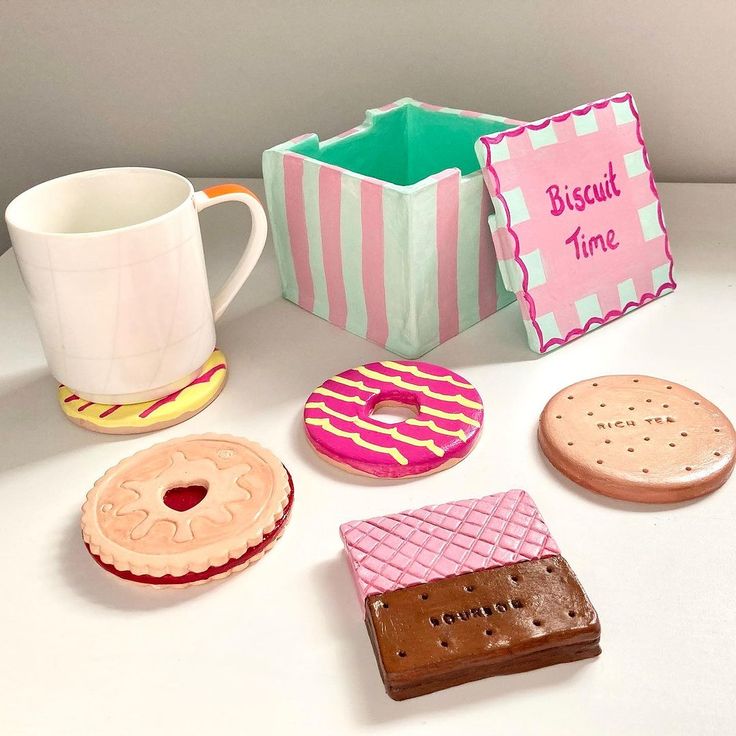 there are many different types of donuts and cookies on the table next to each other