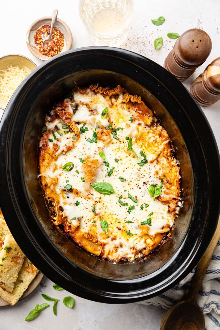 a close up of a casserole in a crock pot on a table