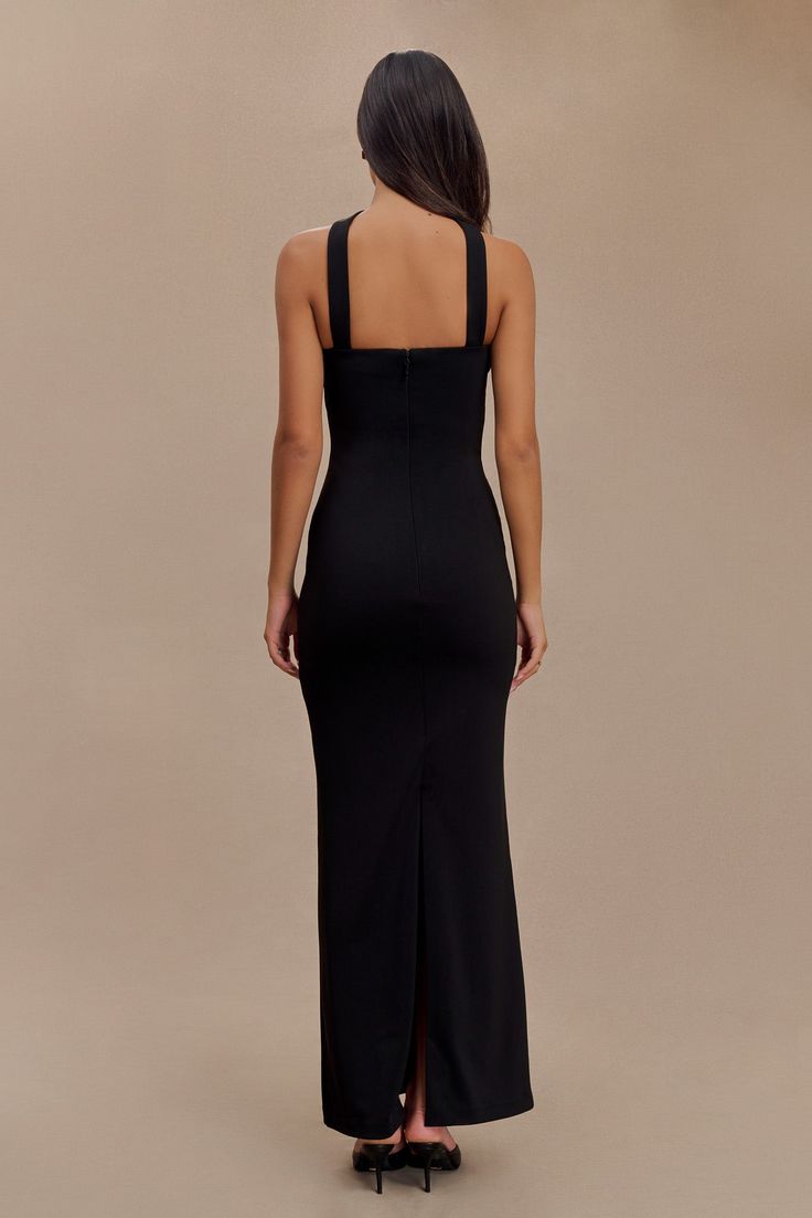 Boldly elegant. The VELMA Halter Collar Maxi Dress with Overlay is a striking blend of elegance and modern sophistication. Featuring a straight neckline and a halter design, this dress showcases a front collar detail that adds a refined touch. The fitted bodice enhances your silhouette, while the maxi length and back vent offer graceful movement and a dramatic effect. The back zip closure ensures a seamless fit, making the Velma Dress a perfect choice for formal events or special occasions where you want to make a memorable impression. Dress With Overlay, Collar Maxi Dress, Graceful Movement, Straight Neckline, Black Swimwear, Crepe Dress, Brown Dress, Embellished Dress, Dress Suits