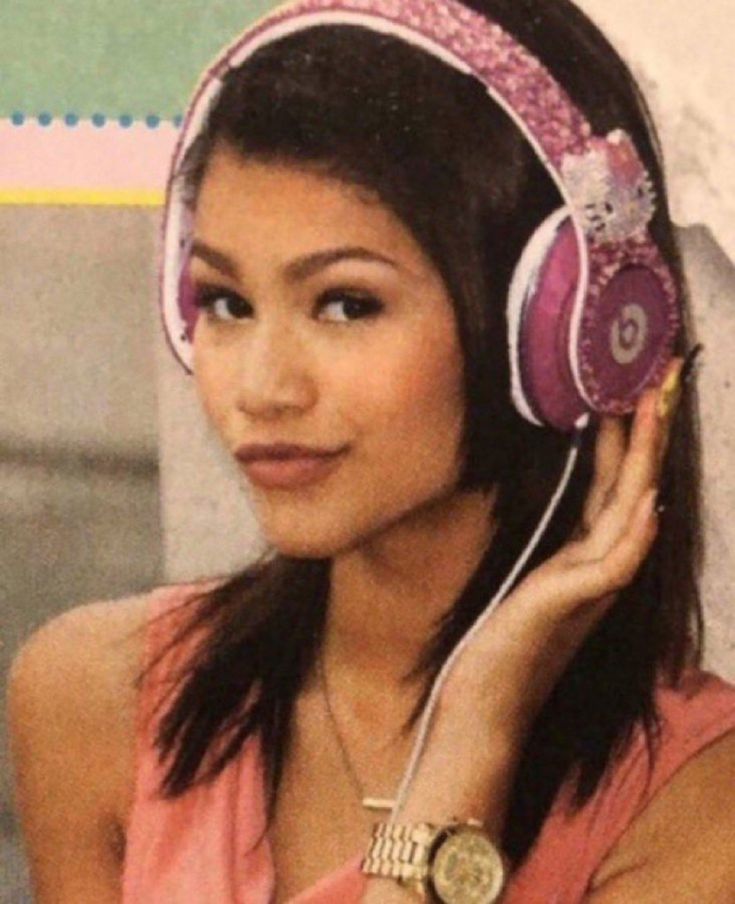 a woman with headphones on her ears