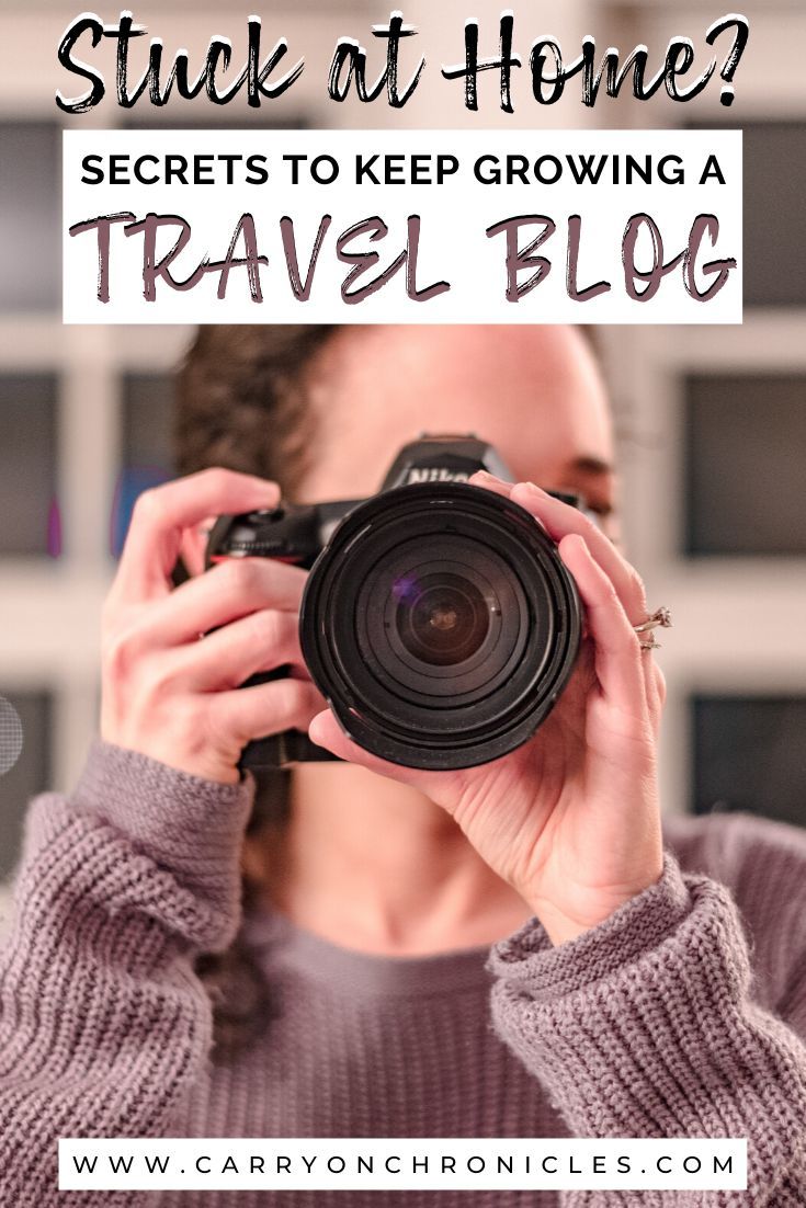 a woman holding up a camera with the words stuck at home? secrets to keep growing a travel blog