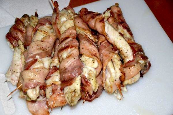 chicken and meat skewers on a cutting board