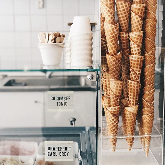 several cones of ice cream in a display case