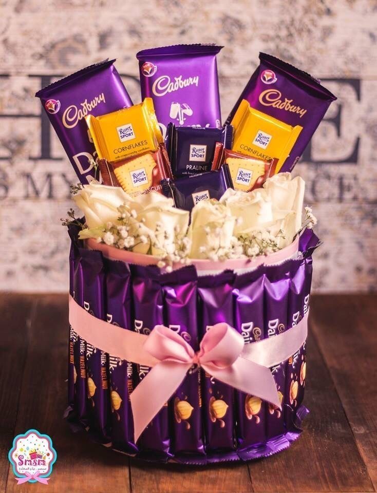 a basket filled with chocolates and candy bars