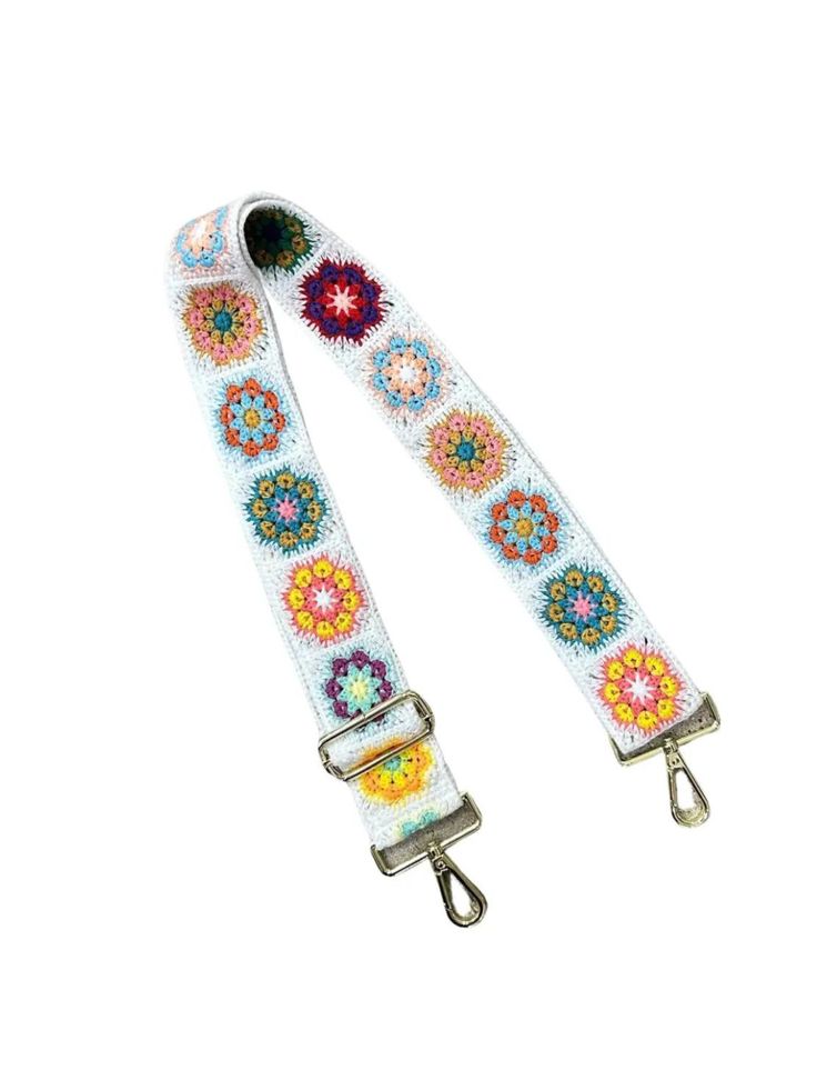 a white strap with colorful flowers on it