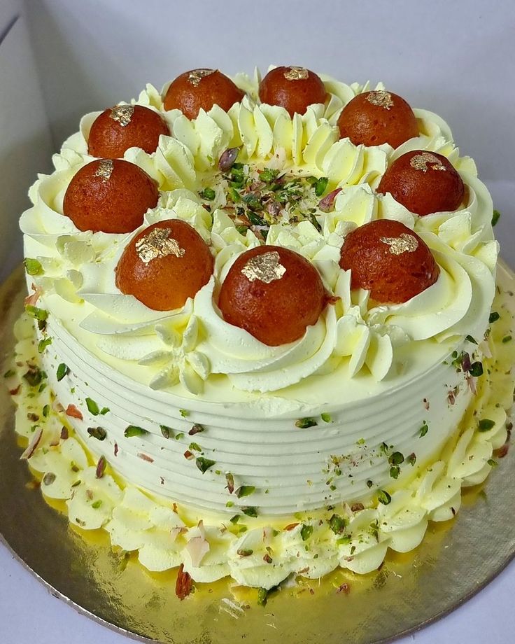 a cake with white frosting and red toppings