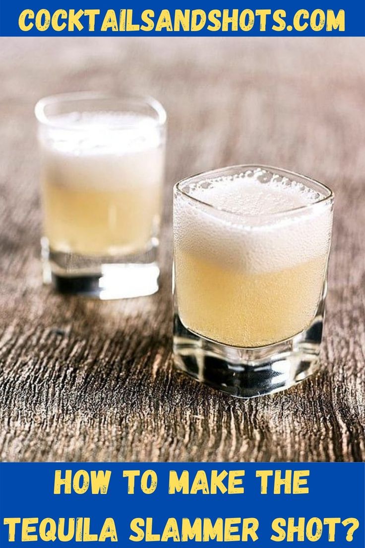 two shot glasses filled with tequila sitting on top of a table next to each other