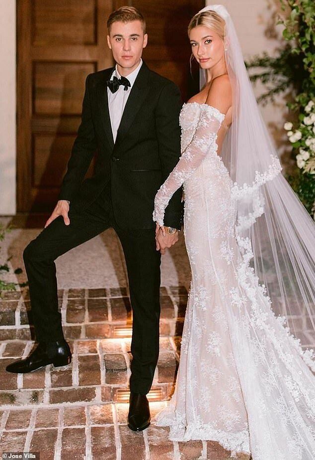 a bride and groom posing for a photo