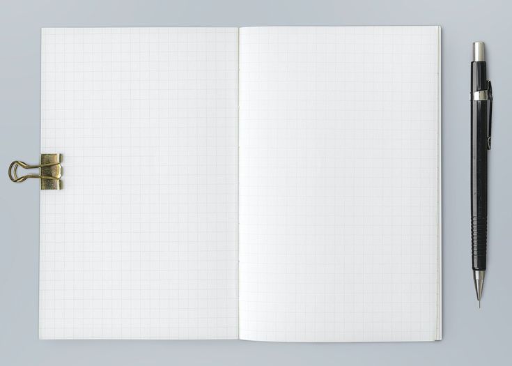 an open notebook with a pen next to it