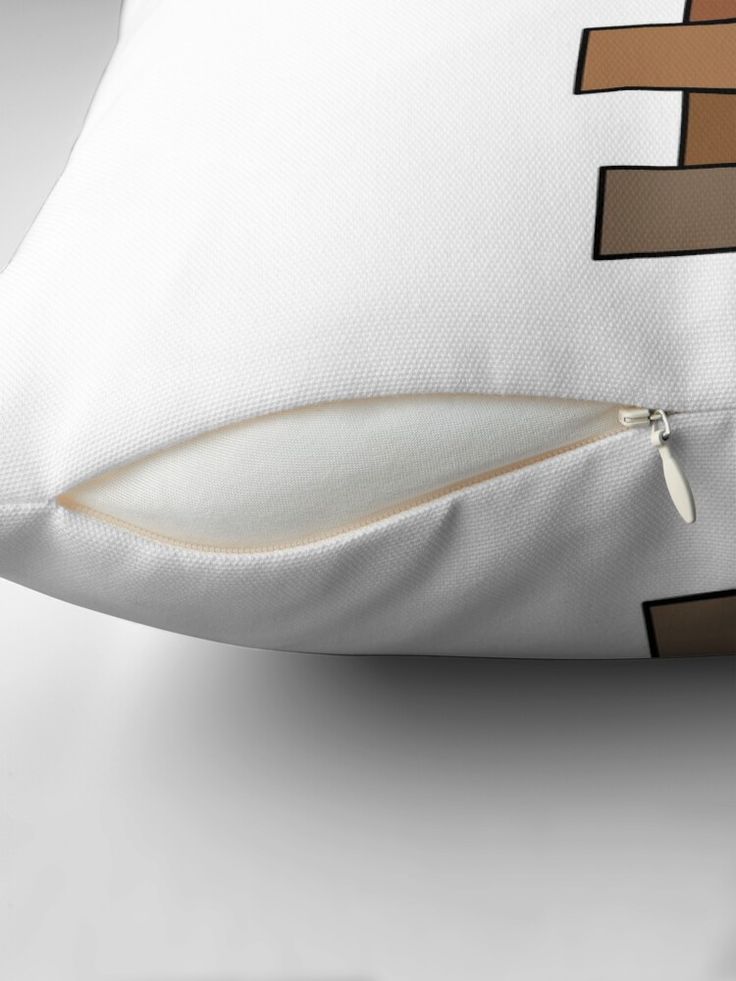 a close up of a pillow on a white surface with brown and black lines around it