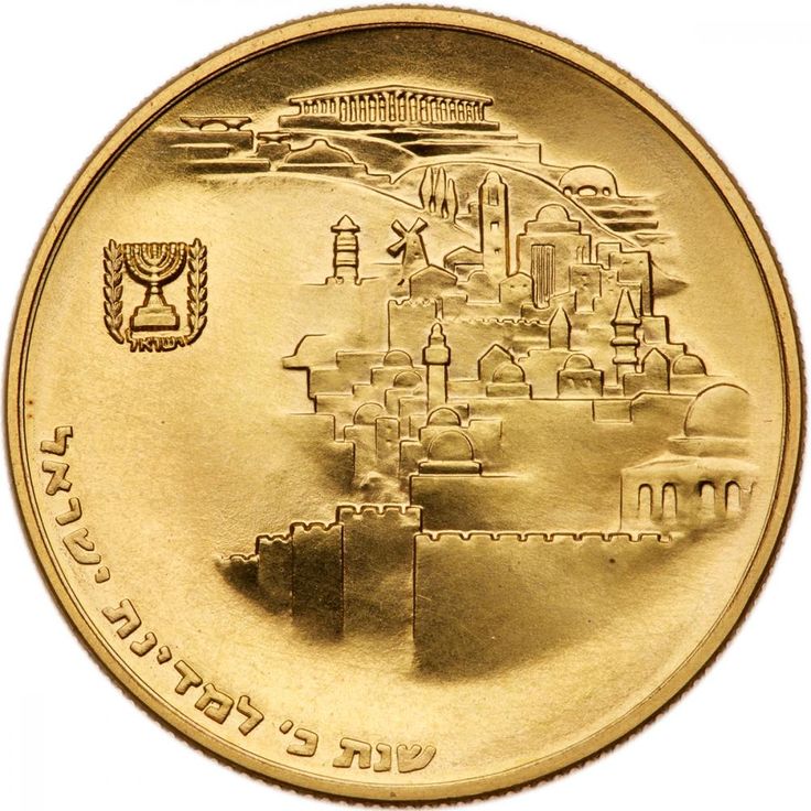 a gold coin with an image of a castle on the front and arabic writing on the back