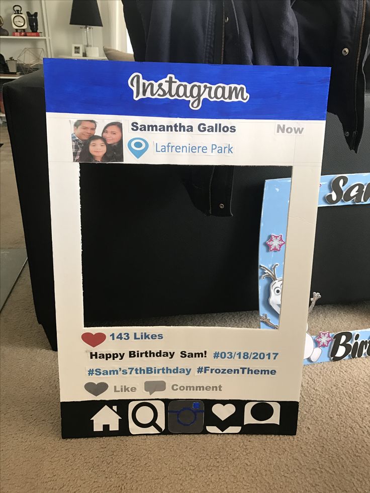 an instagram photo frame for someone's birthday is displayed on the floor in front of a black suitcase