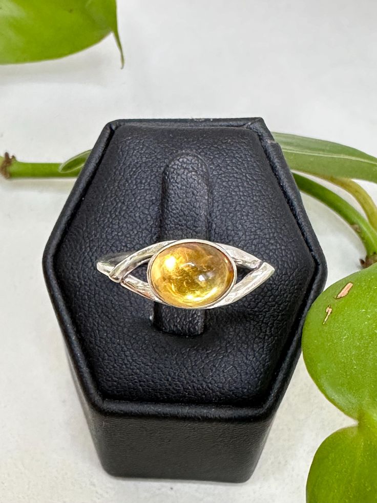 Sterling silver golden citrine ring. This stone is oval shape in a bezel setting. Oval Yellow Citrine Birthstone Ring, Oval Citrine Birthstone Ring, Oval Citrine Gemstone Ring, Silver Citrine Oval Crystal Ring, Oval Citrine Silver Ring, Yellow Oval Crystal Gemstone Ring, Oval Citrine Crystal Ring With Birthstone, Yellow Oval Crystal Ring With Gemstone, Oval Citrine Birthstone Crystal Ring