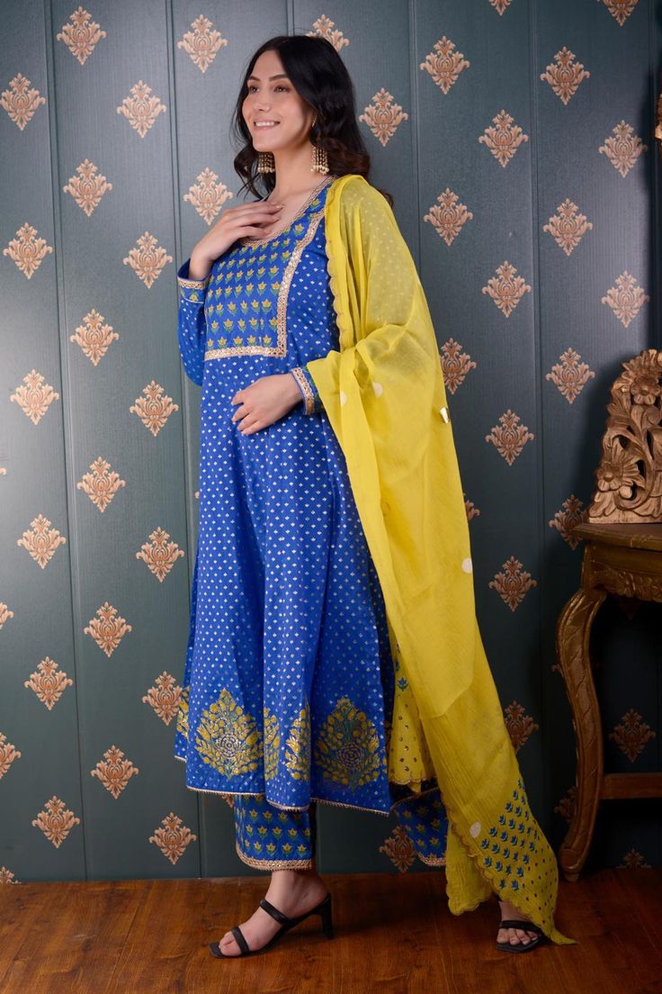 Royal blue anarkali with floral foil print and lace trim on the neckline and sleeve hems. Comes with palazzo and lemon yellow chanderi dupatta.
Component: 3
Pattern: Print and Embroidery
Type Of Work: Foil Print, Sequin and Thread
Neckline: Round
Sleeve Type: Full
Fabric: Anarkali: Banarasi Chanderi, Palazzo: Cotton Satin and Dupatta: Chanderi
Color: Blue
Other Details: 
Floral print dupatta with scalloped border
Lace trim on the neckline, bodice and sleeve hem
Occasion: Puja - Aza Fashions Royal Blue Anarkali, Chanderi Anarkali, Blue Anarkali, Chanderi Dupatta, Border Lace, Scalloped Border, Types Of Work, Palazzo Set, Blue Foil