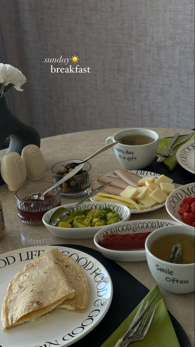 a table topped with plates and bowls filled with food