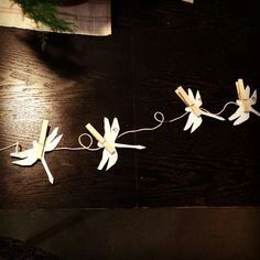 some paper flowers are hanging on a string