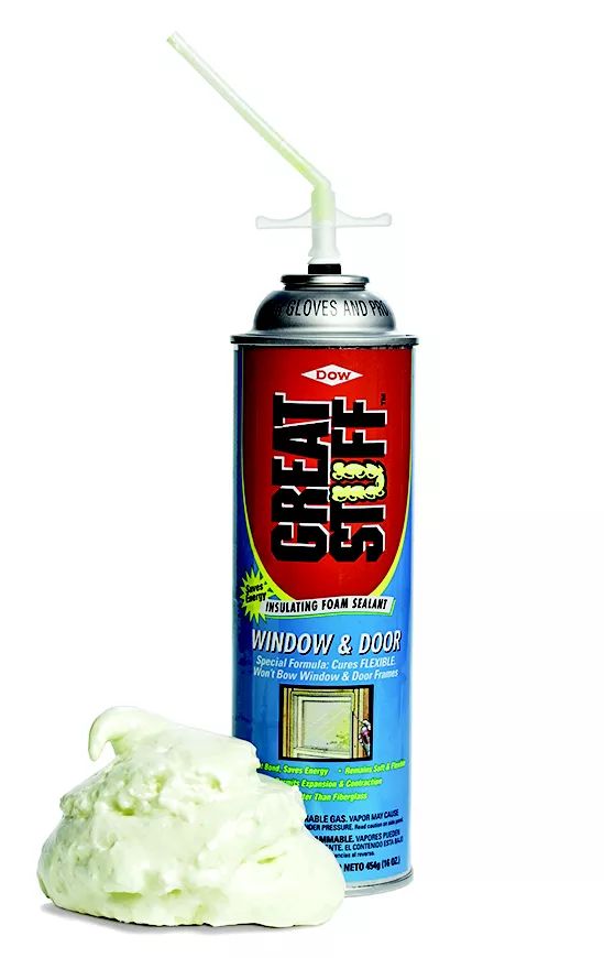 a can of spray paint next to a white object