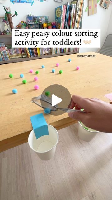 a child is playing with some sort of activity for toddlers to do on the table