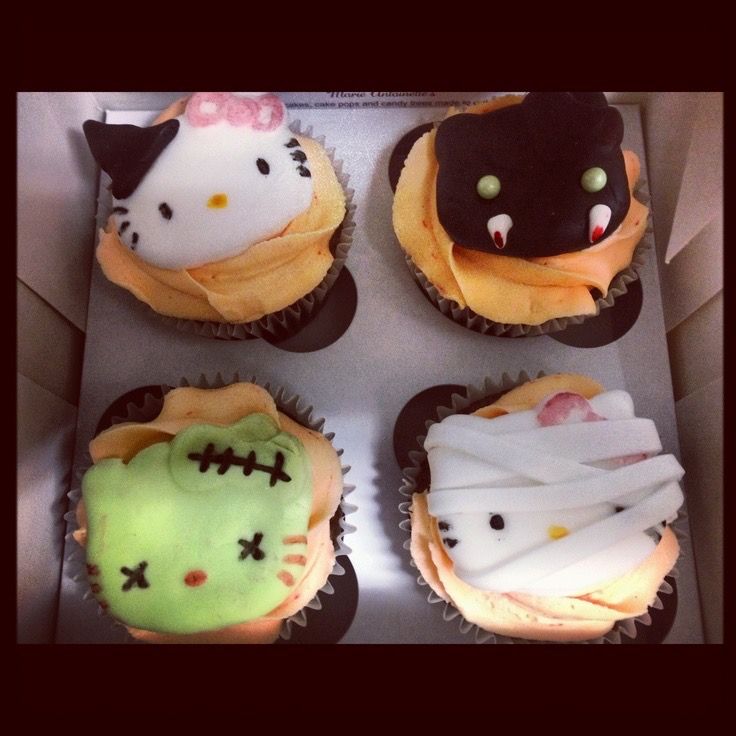 hello kitty cupcakes are decorated with halloween decorations