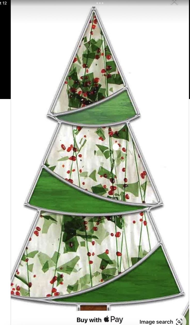 a christmas tree made out of stained glass with holly and berries on the bottom, in front of a white background