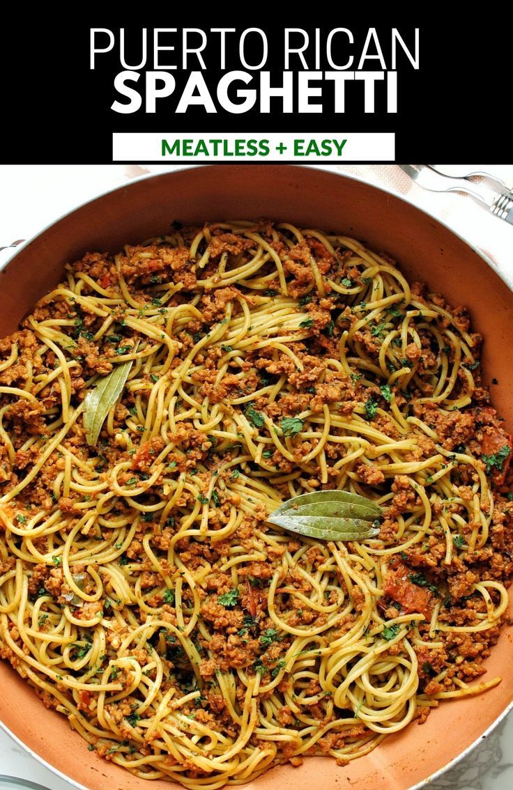 a large pan filled with spaghetti and meat