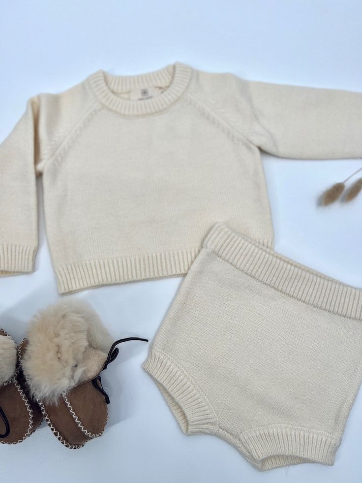 We love a good cozy set for our littlest babes! Thick knit design for warmth and comfort. Elastic waist and cuffs. Cozy Cotton Sets For Fall, Cozy Knitted Sweater For Casual Wear, Cozy Fitted Sets For Winter, Cozy Playtime Sets For Fall, Knitted Cotton Sets For Winter, Ribbed Loungewear Sets For Winter, Fitted Cream Sets For Winter, Cozy Knitted Sweater For Playtime, Knitted Cotton Winter Sets