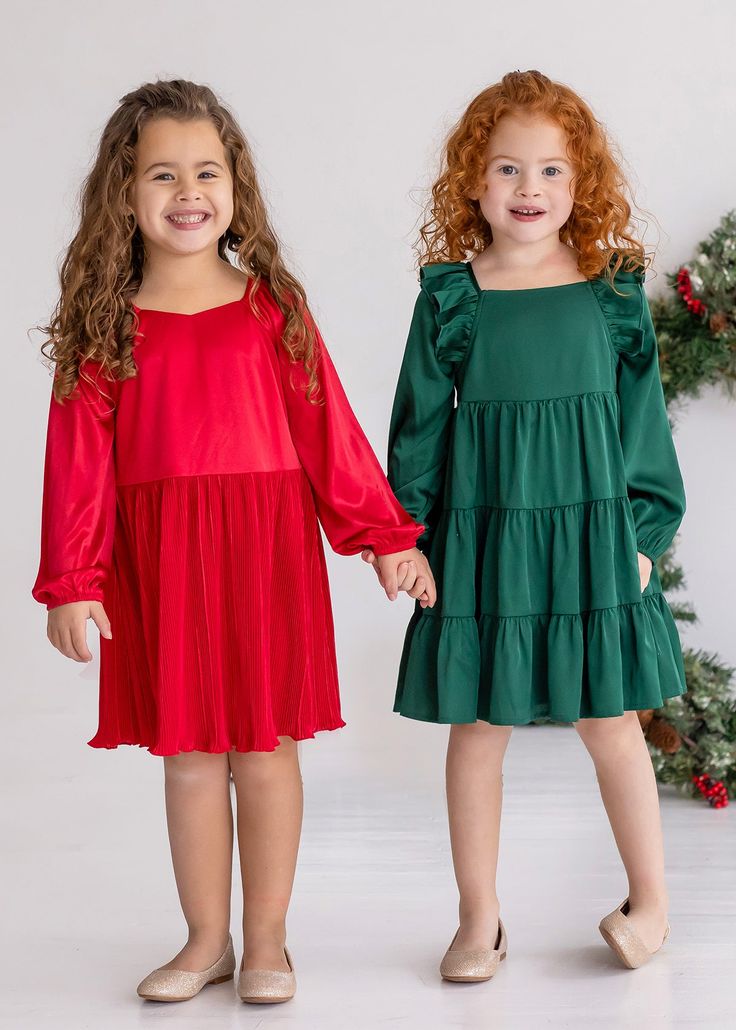 This enchanting natural waist dress features gathered shoulders and a flowing pleated skirt for a touch of grace. The long sleeves offer comfort and warmth, making it the perfect festive choice for holiday gatherings and celebratory events. Fabric Care Machine Wash Cold | Line Dry Do Not Bleach Long Sleeve Dress For Holiday Dress-up, Festive Dresses With Gathered Sleeves, Festive Holiday Dress With Ruffles, Festive Ruffled Holiday Dress, Festive Holiday Dress With Ruffles For Dress-up, Long Sleeve Christmas Dresses With Ruffles, Long Sleeve Ruffled Dresses For Christmas, Long Sleeve Christmas Dress For Dress-up, Festive Holiday Dress With Ruffles And Long Sleeves