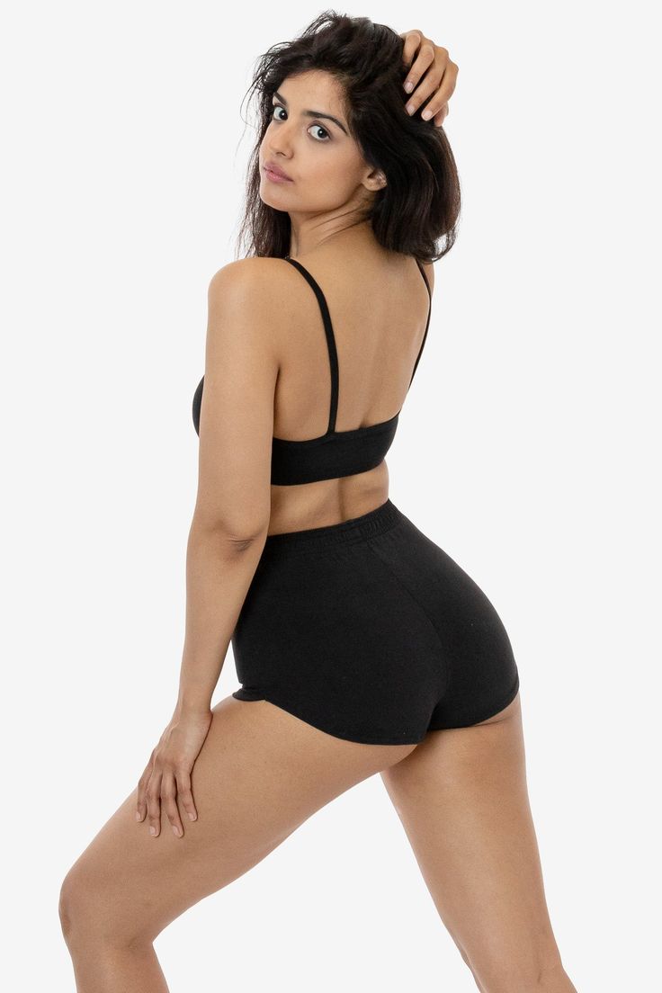 These cheeky hot shorts have a vintage, sporty-inspired look. Made of our heavyweight cotton spandex, these shorts feature a multi-needle elastic waist and curved dolphin hem and have been garment dyed for a rich, smooth finish. Pair with our matching 83016GD Spaghetti Bralette or any of our rib tanks for a timeless look. Perfect for at-home workouts or roller skating by the beach. Runs small, we recommend sizing up one size if you are in between sizes. Made in South Central, Los Angeles. Our ex Hot Short, Hot Shorts, Cotton Spandex, Kendall Jenner, Dolphins, Bralette, Elastic Waist, Dye, Black