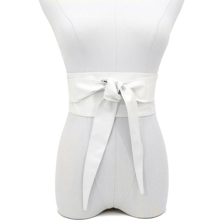 Indulge in the luxurious feel of our Obi Wrap Belt in White, crafted from buttery soft Italian leather. Made from premium Italian leather, this belt is smooth to the touch and designed to flatter your figure. The 3 3/4" width in the front gracefully tapers to a comfortable fit in the back, ensuring a stylish and secure look all day long. Unlike stiff belts that can dig in, this Italian leather belt conforms to your curves for ultimate comfort. Elegant Faux Leather Corset Belt, Chic Leather Corset Belt For Party, Chic Belted Corset Belt For Spring, Leather Corset Belt For Spring, Spring Leather Corset Belt, Chic Leather Corset Belt For Spring, Chic Spring Corset Belt With Removable Feature, Chic Spring Corset Belt With Removable Belt, Spring Evening Corset Belt