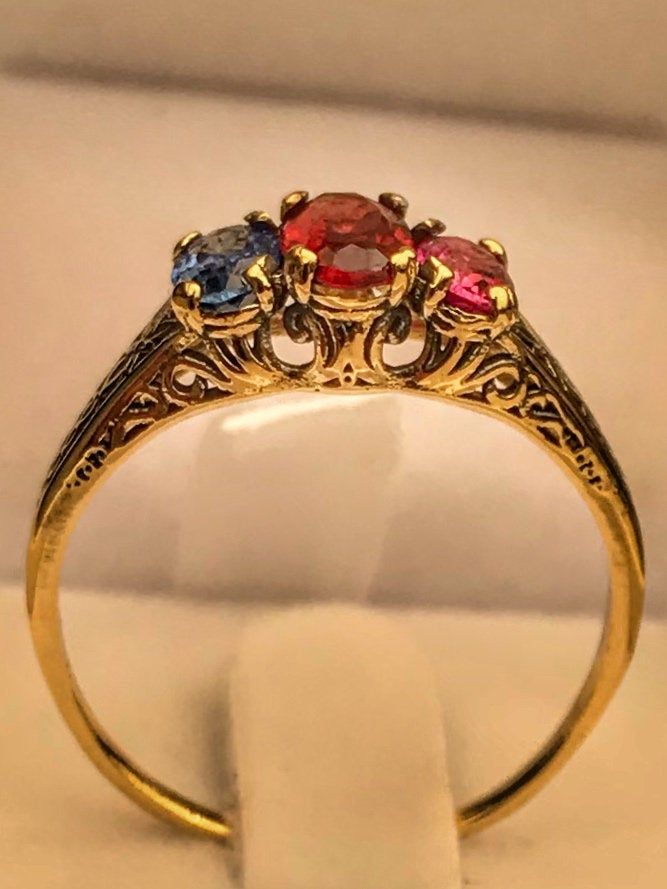 "Very unique handmade gold ring with real gamstones . 14k gold antique victorian ring with a real garnet stones in the middele + 1 real beautiful ruby in the side + one real beautiful sapphire on the other side . Hand made by myself Weight : about 1.9 gram Central stone : garnet 4/6 m\"m Ruby stone : 3/5 mm Sapphire stone : 3/5 mm" Elegant Three Stone Birthstone Ring In 14k Gold, Gold Ruby Rings With Intricate Design, Gold Ruby Ring With Rose Cut Diamonds, Three Stone Ruby Ring In 14k Yellow Gold, Heirloom Gold Ruby Ring With Rose Cut Diamonds, Elegant Gold Ruby Ring With Rose Cut Diamonds, Heirloom Ruby Ring With Rose Cut Diamonds In Gold, Elegant Yellow Gold Ruby Ring With Intricate Design, Elegant Three Stone Ruby Ring