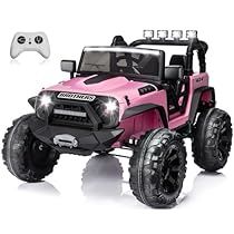 a pink toy truck with two large tires and a remote control controller for the game