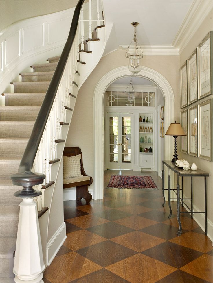 an entryway with a staircase leading up to the second floor