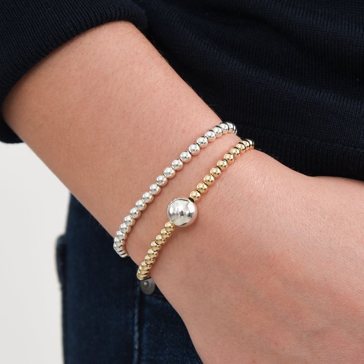 One of our classics from the beaded lux collection. Stack this dainty stretch bracelet with other metals to mix it up or keep it all silver! This style is created with one of our "stretchy" cords for easy wear and effortless bracelet stacking. Sterling Silver beads are approximately 4mm in size. We want to make sure your stretch bracelet has the perfect fit, so we have created sizing options to select above. Please contact us if you have any sizing questions or would like a custom size. Classic Silver Charm Bracelet For Everyday, Classic Stackable Beaded Bracelets, Classic Charm Bracelet With Sterling Silver Clasp, Classic Silver Charm Bracelet, Adjustable Classic Charm Bracelet For Everyday, Classic Charm Bracelet With Sterling Silver Clasp For Everyday, Adjustable Classic Charm Bracelet, Classic Silver Bracelets For Everyday, Elegant Silver Stackable Charm Bracelet