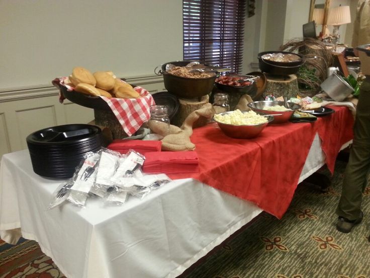 a buffet table with food on it in a room