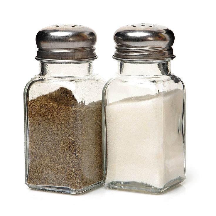 two salt and pepper shakers on a white background