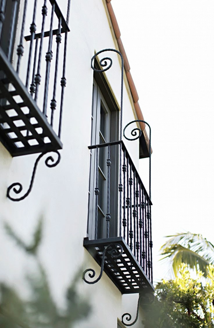 an apartment building with wrought iron balconies